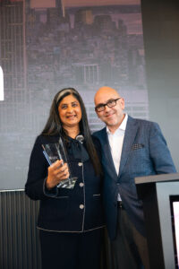 Tina Shah Paikeday accepts the AESC Vanguard Award on behalf of Findem