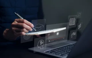 close-up of a person in front of a laptop with digital document management system icons overlaid