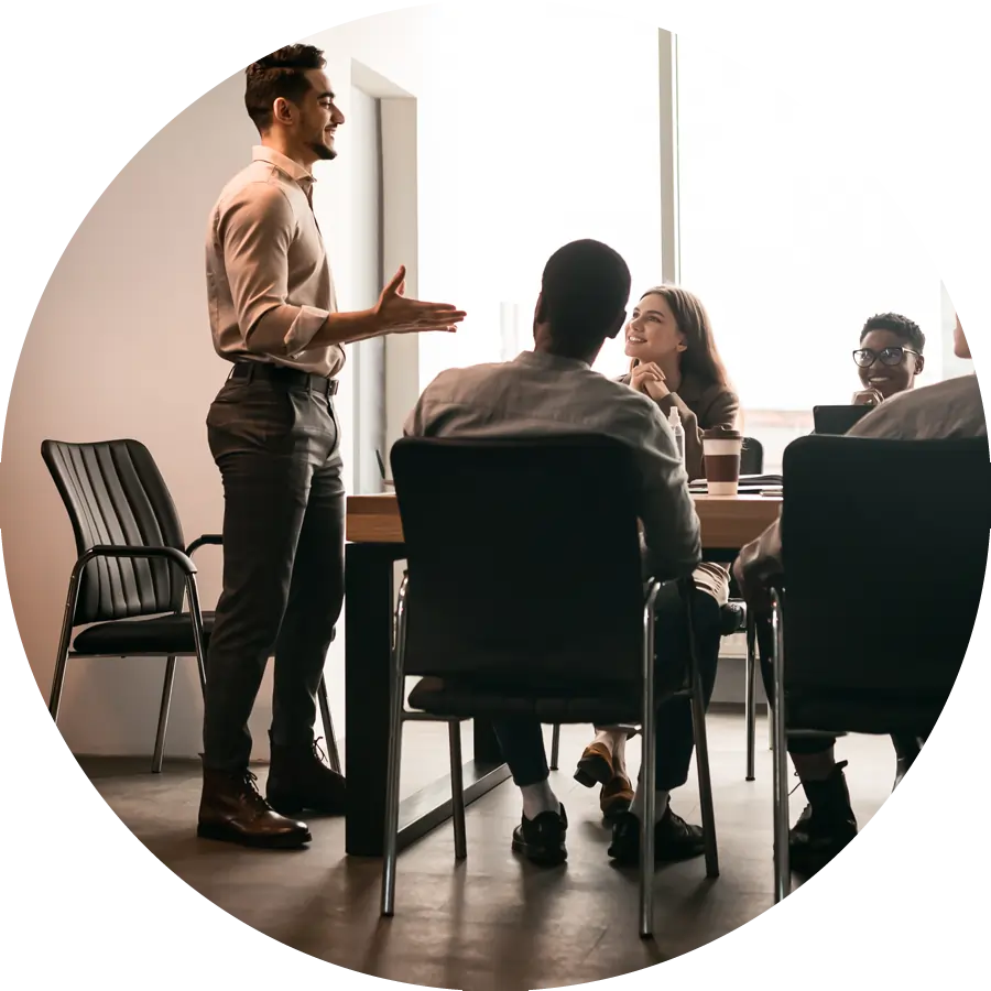 man leading team in conference room