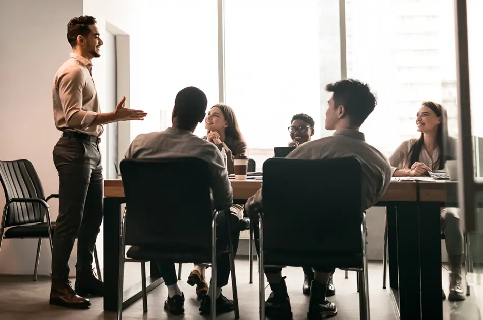 man leading team in conference room