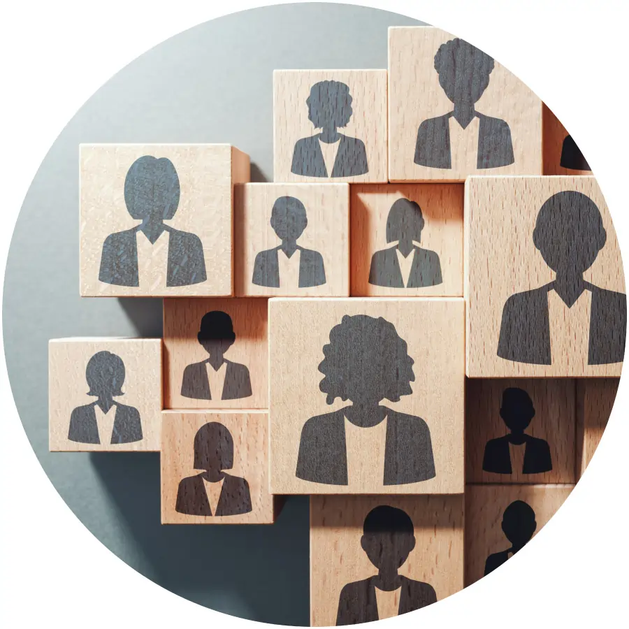 collection of wooden blocks each featuring a silhouetted profile of a person