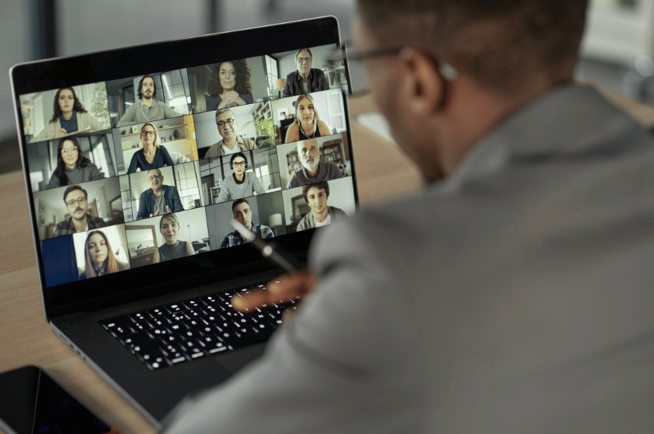 Professional attending a virtual event on a laptop