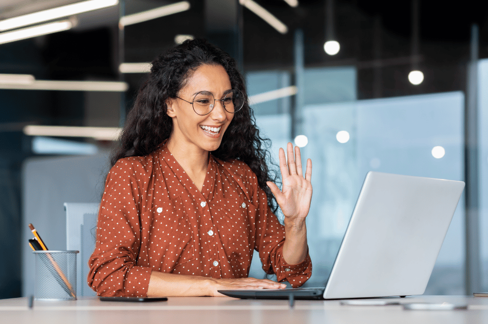Professional woman on a zoom call, waving